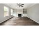 Spacious living room with built-in shelving, fireplace and ample natural light at 3230 Deer Valley Nw Dr, Acworth, GA 30101