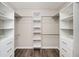 Spacious walk-in closet with wood flooring and built-in shelving at 3230 Deer Valley Nw Dr, Acworth, GA 30101