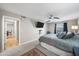 Comfortable bedroom with a soft color palette, ceiling fan and view to hallway at 6851 Roswell Rd # H12, Atlanta, GA 30328