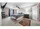 Main bedroom featuring soft carpet, ceiling fan and ensuite bath at 6851 Roswell Rd # H12, Atlanta, GA 30328