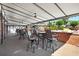 Charming covered patio area featuring comfortable seating and overhead lighting, perfect for relaxing and entertaining at 6851 Roswell Rd # H12, Atlanta, GA 30328