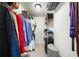 A bright walk-in closet boasts metal shelving providing ample storage for shoes, clothes, and accessories at 6851 Roswell Rd # H12, Atlanta, GA 30328