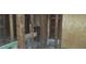 Interior view of a dilapidated space with exposed framing and unfinished surfaces at 868 Oakhill Sw Ave, Atlanta, GA 30310