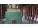 Interior showing exposed framing with a partially finished, green brick fireplace at 868 Oakhill Sw Ave, Atlanta, GA 30310