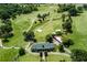 Aerial view of a well-manicured golf course with ponds, sand traps, and tree-lined fairways at 1145 Kingston Drive, Atlanta, GA 30342