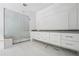 Bathroom featuring a glass enclosed shower and a white double vanity with a dark countertop at 1145 Kingston Drive, Atlanta, GA 30342