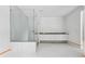 Bathroom featuring a glass enclosed shower and a white double vanity with a dark countertop at 1145 Kingston Drive, Atlanta, GA 30342