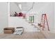 Bright entryway showcasing a staircase and an exterior door with natural light at 1145 Kingston Drive, Atlanta, GA 30342