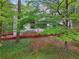 Beautiful shot of exterior with trees at 1145 Kingston Drive, Atlanta, GA 30342