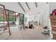 View of the unfinished kitchen with view of the second story and backyard at 1145 Kingston Drive, Atlanta, GA 30342
