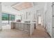 Unfinished kitchen island and cabinetry beneath a wooden ceiling feature at 1145 Kingston Drive, Atlanta, GA 30342