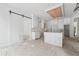 An expansive kitchen features an island, wood ceiling design, and stylish white cabinetry at 1145 Kingston Drive, Atlanta, GA 30342