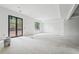 Spacious living room area with an abundance of natural light and steel French doors at 1145 Kingston Drive, Atlanta, GA 30342