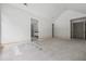 Unfinished main bedroom with doorways and access to bathroom, awaiting personalization and finishing touches at 1145 Kingston Drive, Atlanta, GA 30342