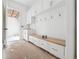 Mudroom with built-in bench seating, coat hooks, drawers, cabinets, and a sink at 1145 Kingston Drive, Atlanta, GA 30342
