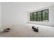 Bright room with a large picture window provides ample natural light and outdoor views at 1145 Kingston Drive, Atlanta, GA 30342