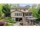 Beautiful backyard featuring a multi-level deck, lush landscaping, and a charming pergola, perfect for outdoor enjoyment at 1434 Churchill Way, Marietta, GA 30062