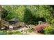 Expansive backyard featuring a well-maintained deck, lush greenery, and a relaxing gazebo, ideal for outdoor gatherings at 1434 Churchill Way, Marietta, GA 30062