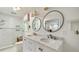 Bathroom featuring marble countertops, dual sinks, and walk-in shower at 1434 Churchill Way, Marietta, GA 30062