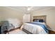 Comfortable bedroom with a plush bed, decorative pillows, and a classic armchair, providing a relaxing retreat at 1434 Churchill Way, Marietta, GA 30062