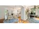 Open dining and office area featuring hardwood floors, modern lighting, and backyard views at 1434 Churchill Way, Marietta, GA 30062