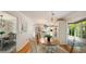 Open dining area featuring hardwood floors, modern lighting, and views into the kitchen at 1434 Churchill Way, Marietta, GA 30062