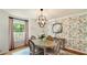 Charming dining room featuring decorative floral wallpaper and hardwood floors at 1434 Churchill Way, Marietta, GA 30062