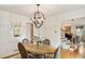 Inviting dining room with hardwood floors and modern chandelier at 1434 Churchill Way, Marietta, GA 30062