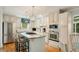 Bright kitchen with island gas cooktop, stainless appliances and custom cabinets at 1434 Churchill Way, Marietta, GA 30062