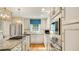 Well-lit kitchen featuring granite countertops, stainless steel appliances, and custom white cabinetry at 1434 Churchill Way, Marietta, GA 30062