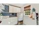 Functional laundry room featuring washer, dryer, and custom cabinetry at 1434 Churchill Way, Marietta, GA 30062