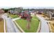 Stunning aerial view of a red-brick home with a manicured lawn in a desirable neighborhood at 1694 Jamie Leigh Ct, Snellville, GA 30078