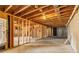 Unfinished basement with exposed ceiling, concrete walls and floors, ready for customization at 1694 Jamie Leigh Ct, Snellville, GA 30078