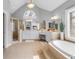 Bright bathroom with walk-in shower, tub, double vanity sinks, decorative lighting and mirrors at 1694 Jamie Leigh Ct, Snellville, GA 30078