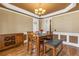 Dining area with hardwood floors, a chandelier, and traditional design at 1694 Jamie Leigh Ct, Snellville, GA 30078
