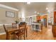 Open concept dining area with hardwood floors, flows to the kitchen and living room at 1694 Jamie Leigh Ct, Snellville, GA 30078