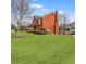 Spacious brick home with a manicured lawn, and driveway at 1694 Jamie Leigh Ct, Snellville, GA 30078