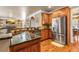 Kitchen features stainless steel appliances, granite countertops, custom cabinetry, and hardwood floors at 1694 Jamie Leigh Ct, Snellville, GA 30078