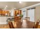 Eat-in kitchen features wooden cabinetry, stainless appliances, and a view to the backyard at 1694 Jamie Leigh Ct, Snellville, GA 30078