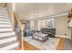 Inviting living room with hardwood floors, neutral colors, and a cozy seating area at 1694 Jamie Leigh Ct, Snellville, GA 30078