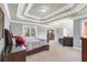 Comfortable main bedroom showing off an open layout, sitting area, and ample space and natural light at 1694 Jamie Leigh Ct, Snellville, GA 30078