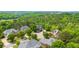 Aerial view of the neighborhood and surrounding trees showing the golf course and community at 2135 Glenfield Trce, Cumming, GA 30041