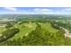 Aerial view of the community with the surrounding golf course and water features at 2135 Glenfield Trce, Cumming, GA 30041