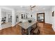 Spacious finished basement with wooden floors, ceiling fan, and an in-home bar with dining furniture at 2135 Glenfield Trce, Cumming, GA 30041