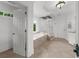 Bright bathroom featuring a glass shower, soaking tub, and neutral tile at 2135 Glenfield Trce, Cumming, GA 30041
