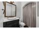 Elegant bathroom with white vanity, vessel sink, and a shower with a curtain at 2135 Glenfield Trce, Cumming, GA 30041