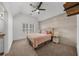 Cozy bedroom featuring a vaulted ceiling, a wood accent wall, and a comfortable bed with a soft color scheme at 2135 Glenfield Trce, Cumming, GA 30041