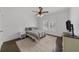 Bright bedroom with neutral decor, plantation shutters, and hardwood floors at 2135 Glenfield Trce, Cumming, GA 30041