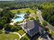 Aerial shot of a community pool area with lush landscaping and a clubhouse at 2135 Glenfield Trce, Cumming, GA 30041