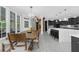 Open-concept kitchen and dining area with modern appliances and ample counter space at 2135 Glenfield Trce, Cumming, GA 30041
